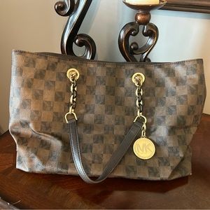 Signature Michael Kors brown tote with chain handles.